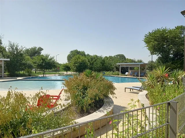 a view of a swimming pool with a patio