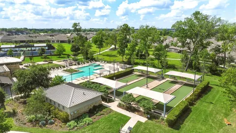 a view of a swimming pool with a yard