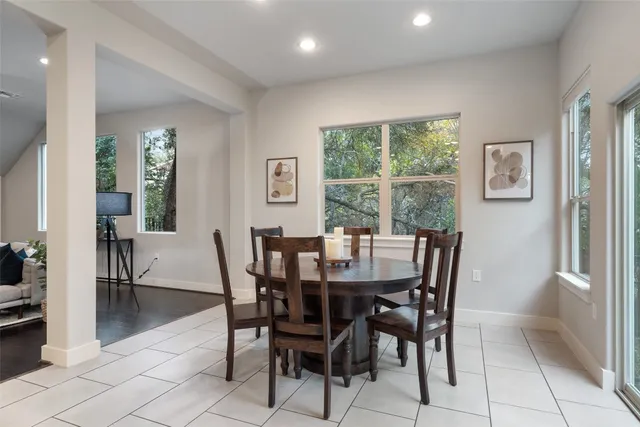 a view of a dining room with furniture and window