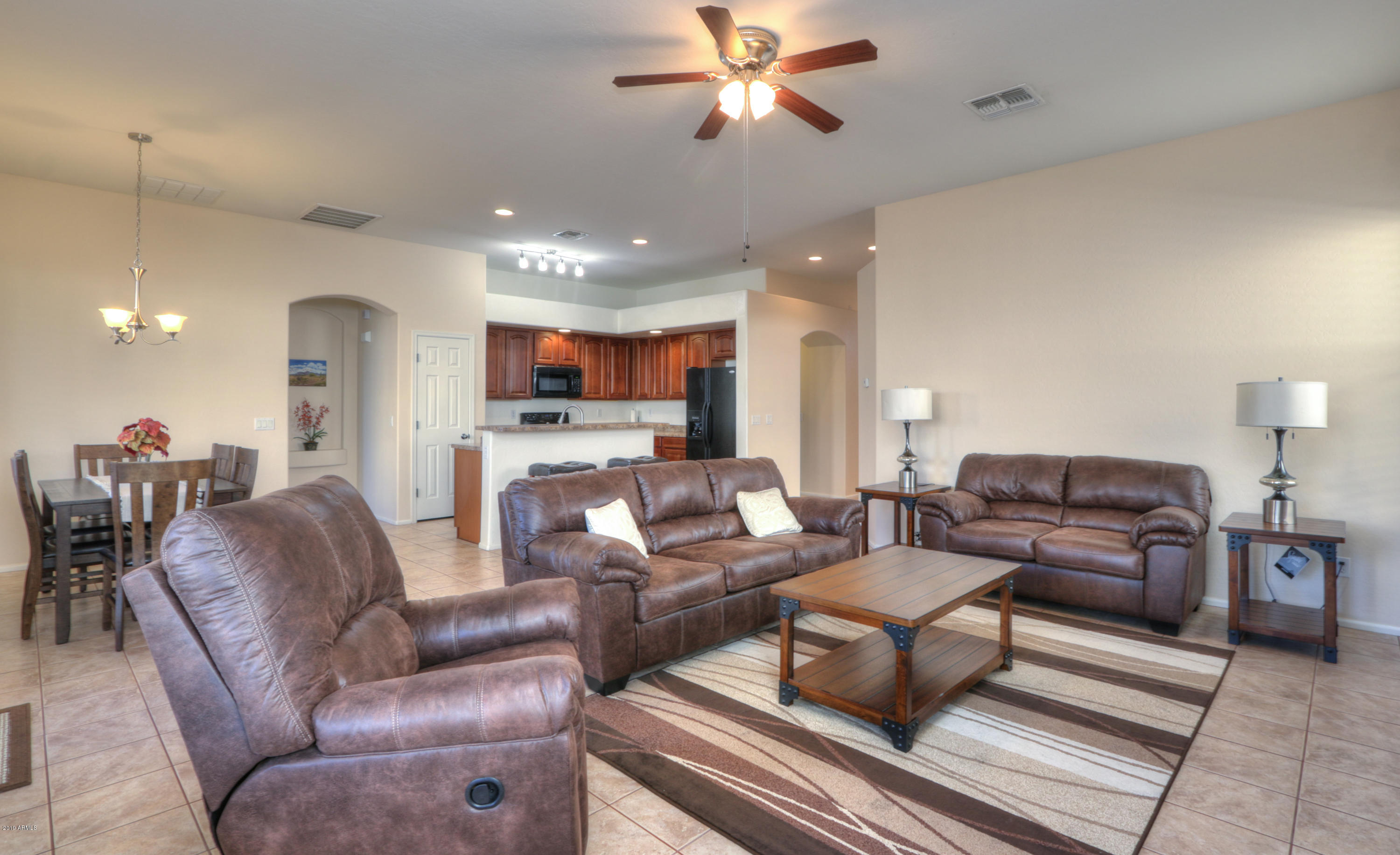 43908 Roth Road Maricopa, AZ 85138 - Photo 13 of 52 Great Room w: Tile Flooring & Ceiling Fa