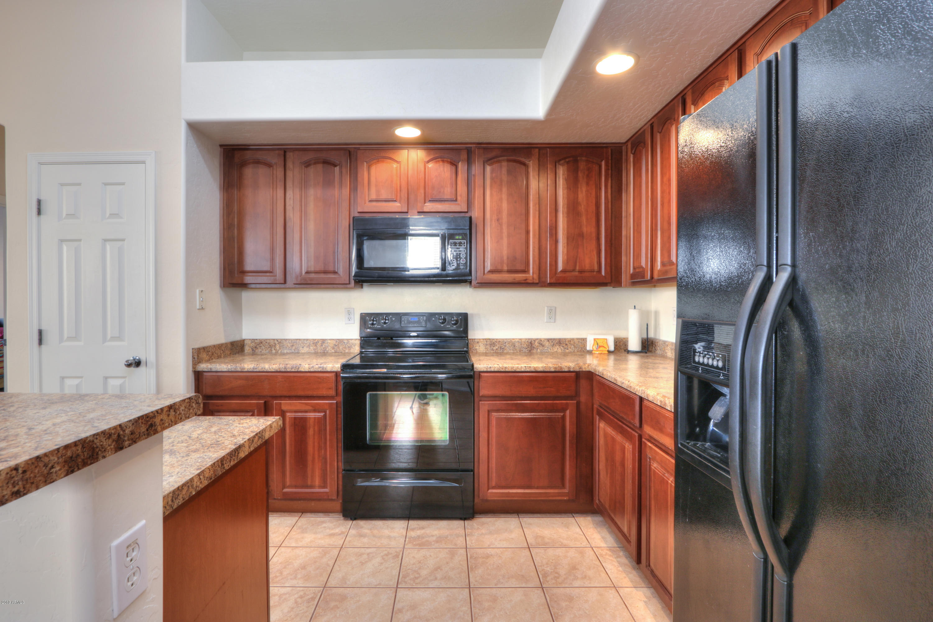 43908 Roth Road Maricopa, AZ 85138 - Photo 8 of 52 Kitchen w: Cherry Cabinets and Refrigera