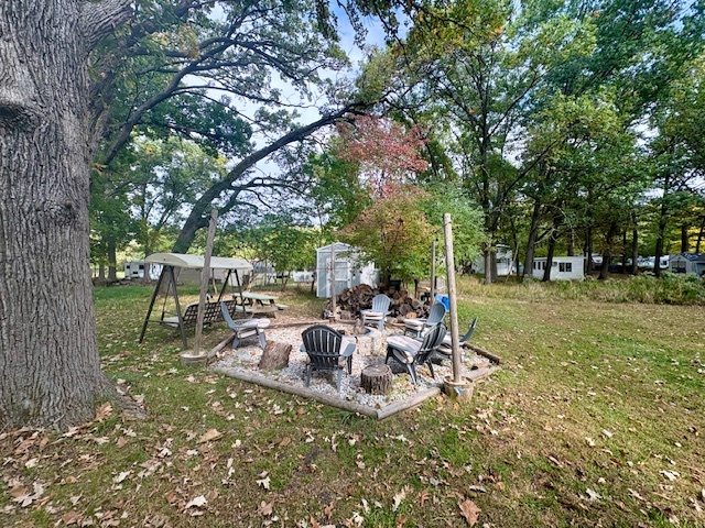 6-45 Woodhaven Sublette, IL 61367 - Photo 2 of 6 a view of a park with bench and a large tree