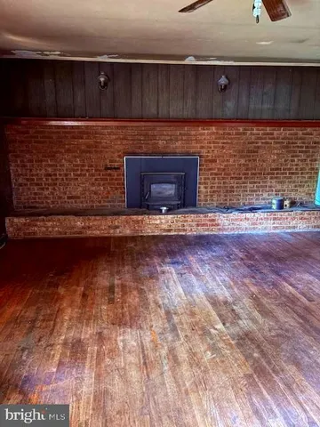 a view of fireplace with wooden floor