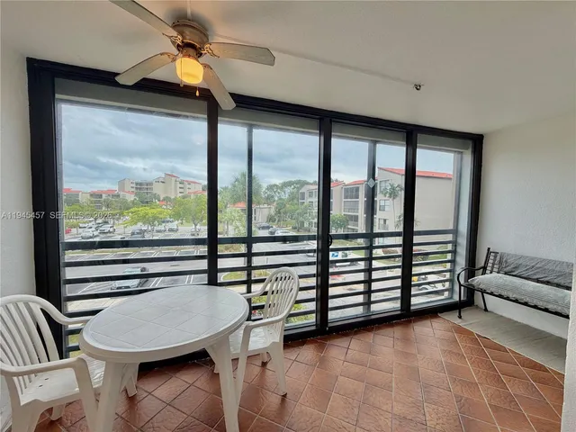 a room with furniture and a large window