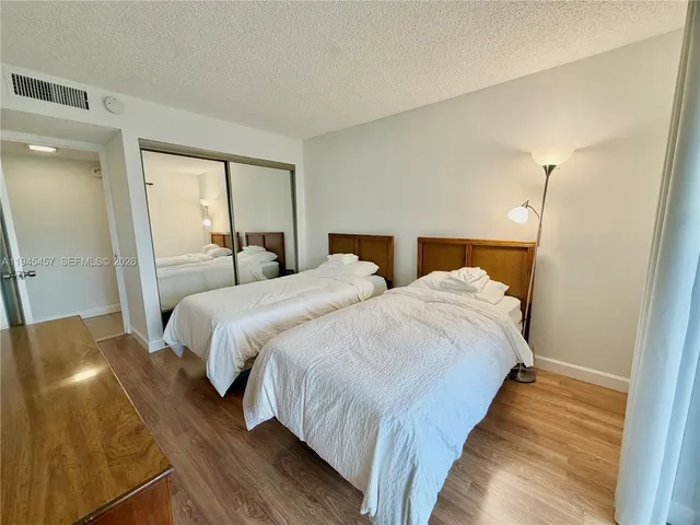 a bed room with a bed and a night lamp