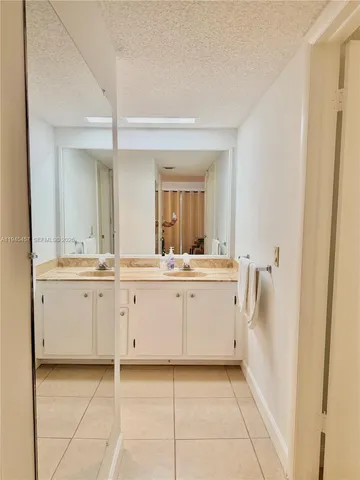 a bathroom with a shower and a sink
