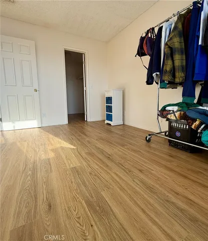 a view of a room with clothes and shoes
