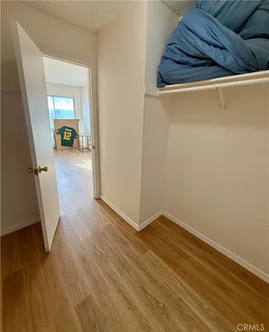 a view of a hallway view with wooden floor and staircase