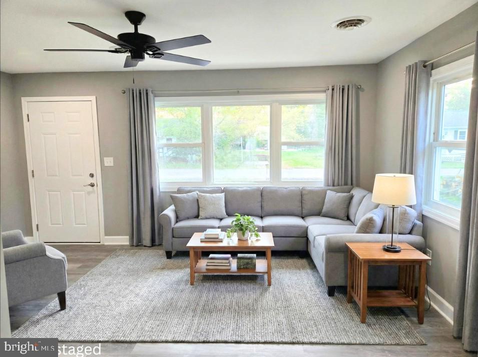 105 Goodwill Avenue Secretary, MD 21664 - Photo 11 of 24 a living room with furniture and a large window