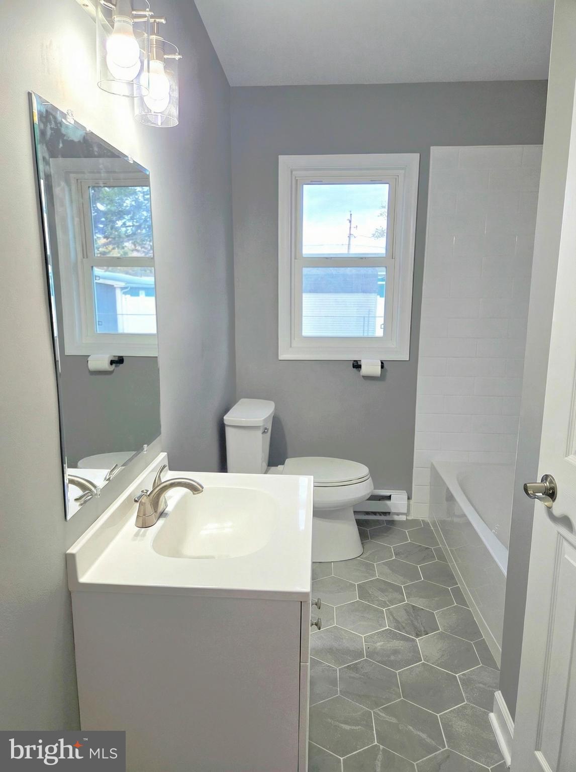 105 Goodwill Avenue Secretary, MD 21664 - Photo 20 of 24 a bathroom with a sink a toilet and a mirror