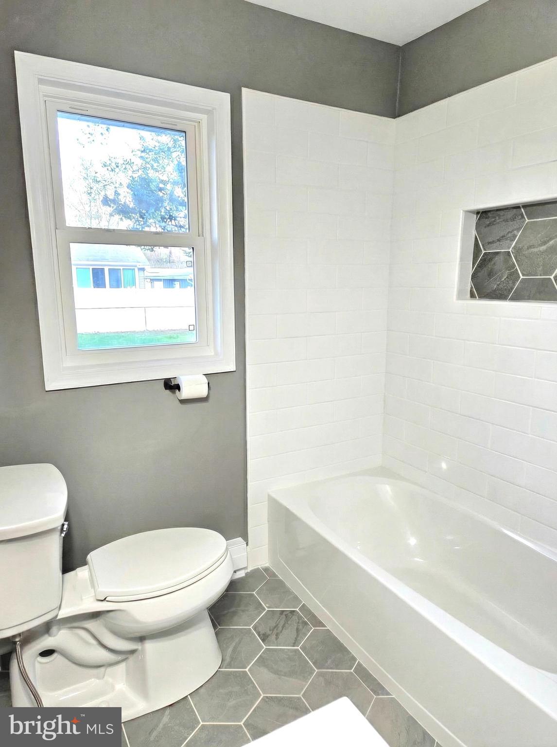 105 Goodwill Avenue Secretary, MD 21664 - Photo 21 of 24 a bathroom with a toilet a sink and a bathtub