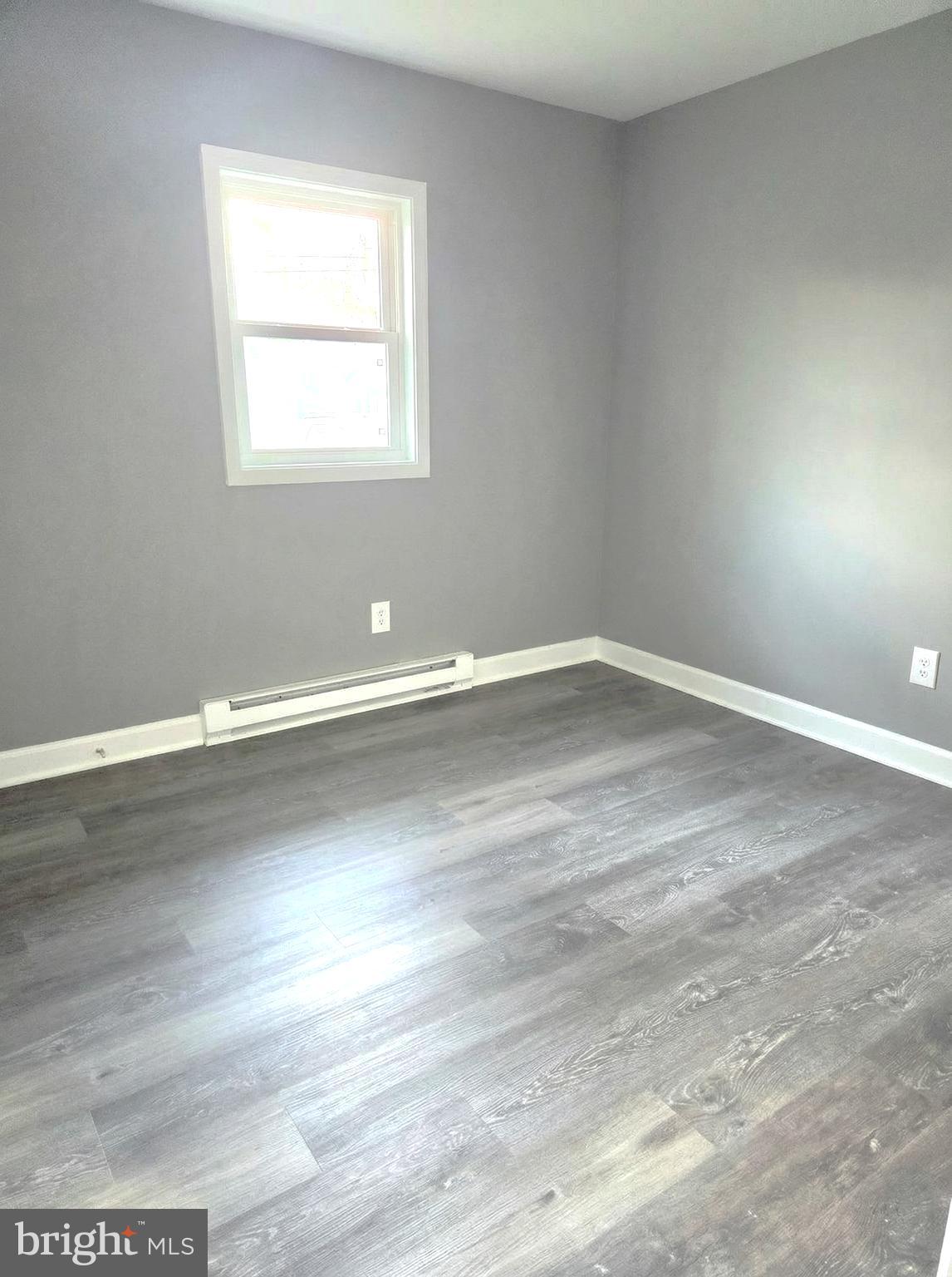 105 Goodwill Avenue Secretary, MD 21664 - Photo 23 of 24 an empty room with wooden floor and windows