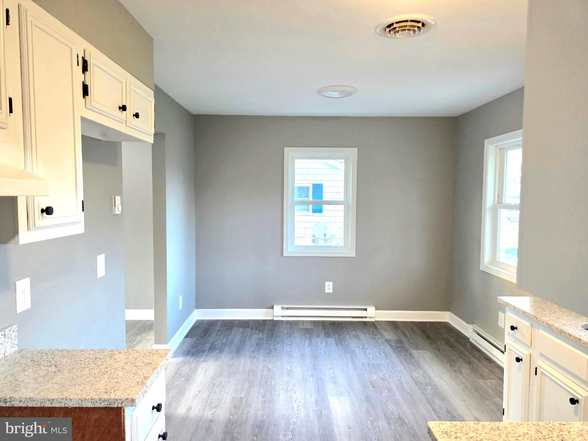 105 Goodwill Avenue Secretary, MD 21664 - Photo 9 of 24 an empty room with wooden floor and windows