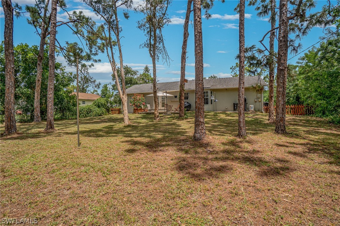 18210 Oak Road Fort Myers, FL 33967 - Photo 20 of 23 a house with trees in front of it
