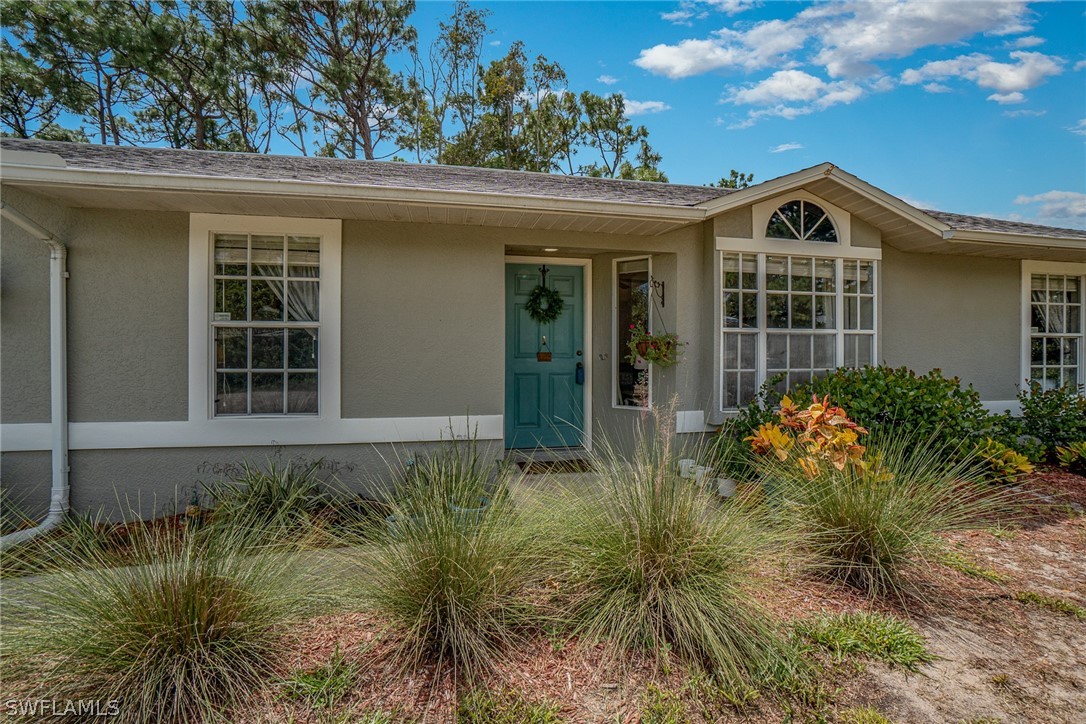 18210 Oak Road Fort Myers, FL 33967 - Photo 23 of 23 a front view of a house with garden