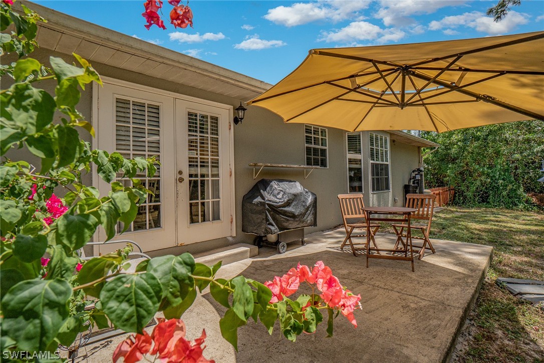 18210 Oak Road Fort Myers, FL 33967 - Photo 3 of 23 a front view of a house with patio