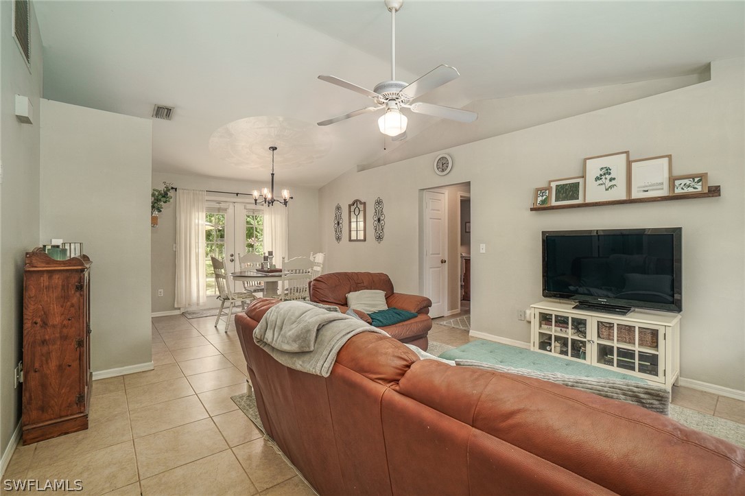 18210 Oak Road Fort Myers, FL 33967 - Photo 5 of 23 a living room with furniture and a flat screen tv
