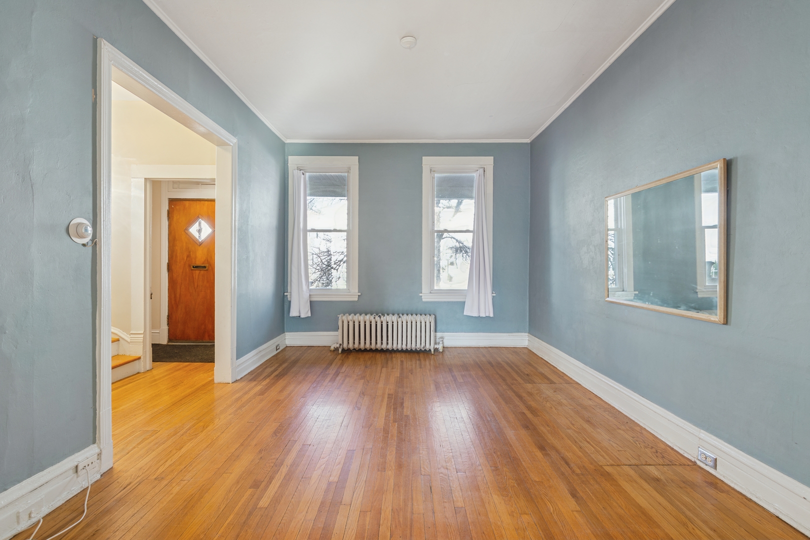 2721 West Prindiville Street Chicago, IL 60647 - Photo 3 of 16 wooden floor in an empty room with a window