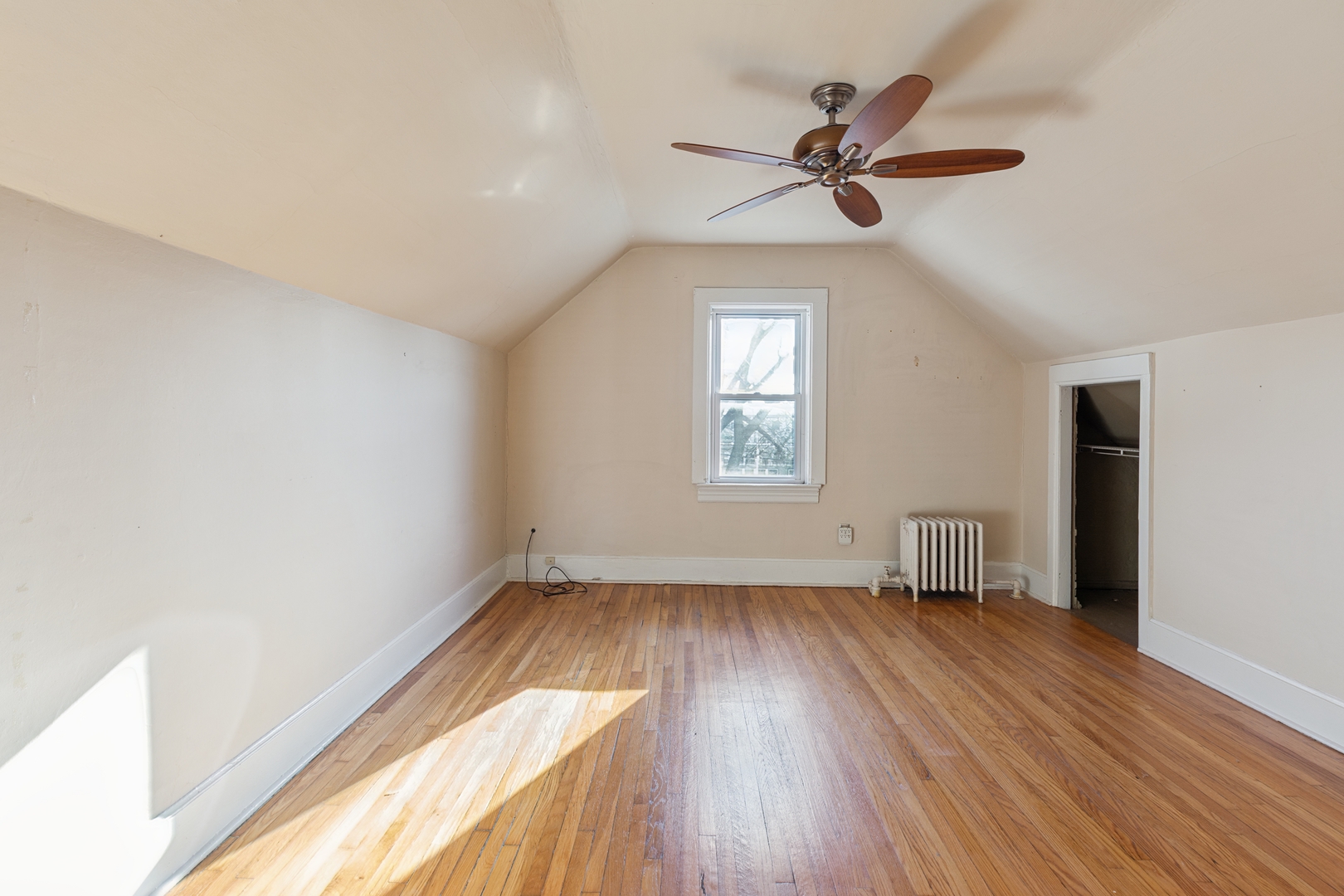 2721 West Prindiville Street Chicago, IL 60647 - Photo 7 of 16 wooden floor in an empty room with a window