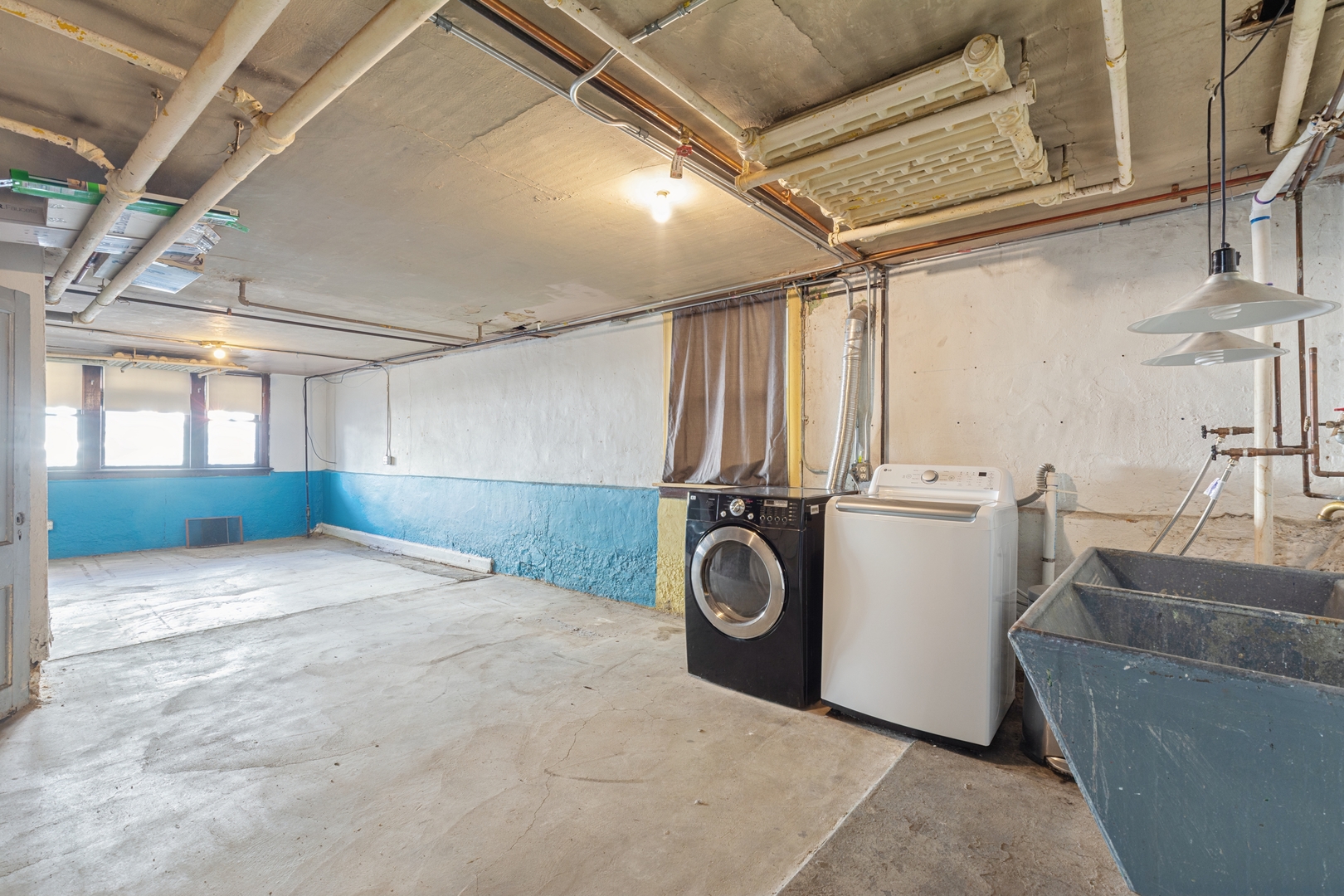 2721 West Prindiville Street Chicago, IL 60647 - Photo 10 of 16 a view of a storage & utility room with a sink