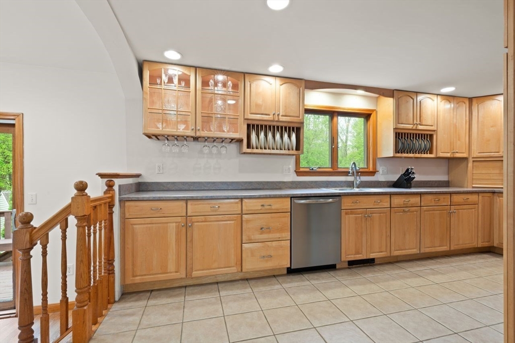 23 Gabriel Road Sharon, MA 02067 - Photo 12 of 41 a kitchen with granite countertop a sink window and cabinets