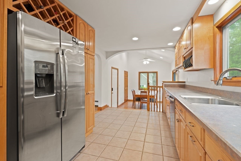 23 Gabriel Road Sharon, MA 02067 - Photo 17 of 41 a large kitchen with a large window and stainless steel appliances