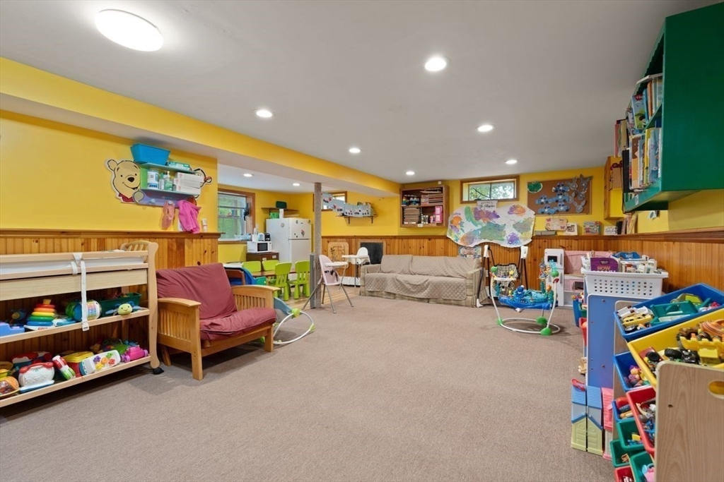 23 Gabriel Road Sharon, MA 02067 - Photo 24 of 41 a living room with lots of furniture and a flat screen tv