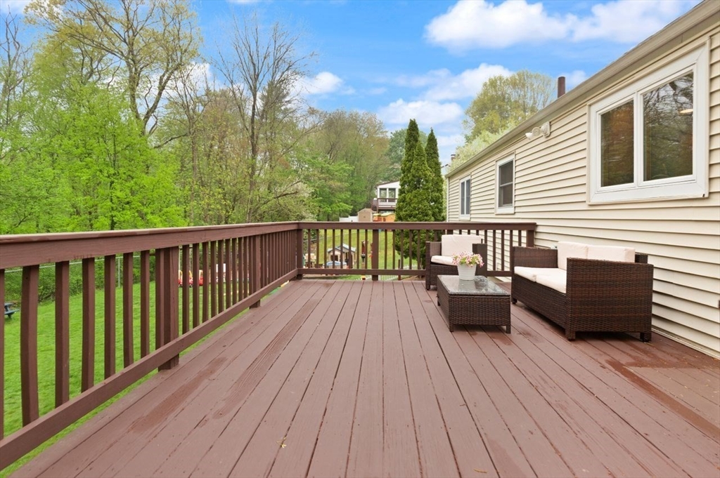 23 Gabriel Road Sharon, MA 02067 - Photo 30 of 41 a view of a wooden deck with furniture