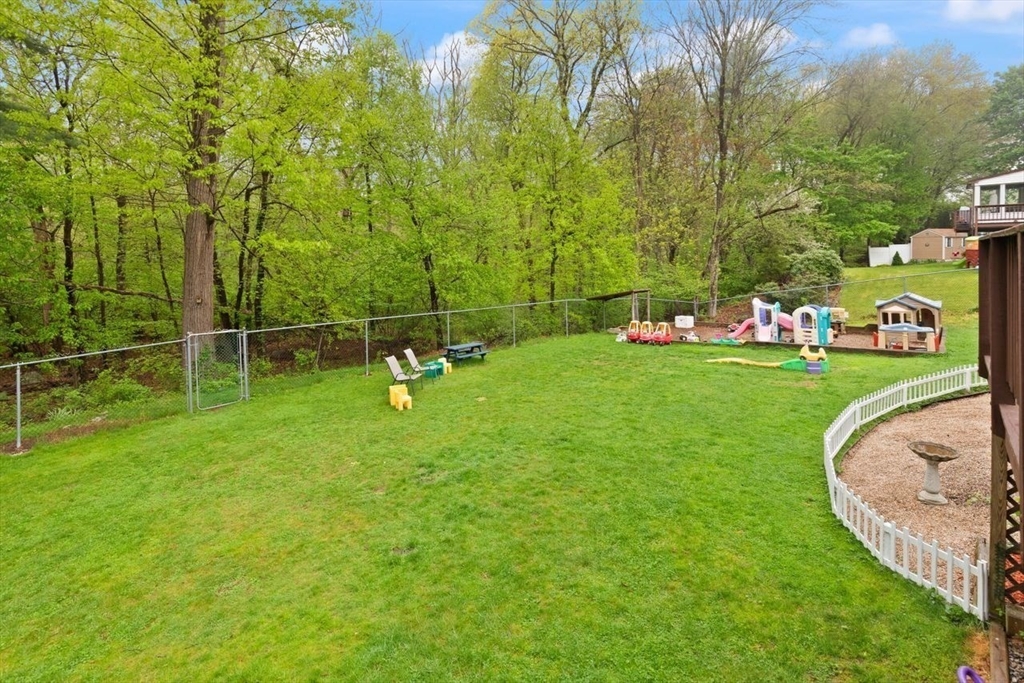 23 Gabriel Road Sharon, MA 02067 - Photo 38 of 41 a backyard of a house with trampoline and tree