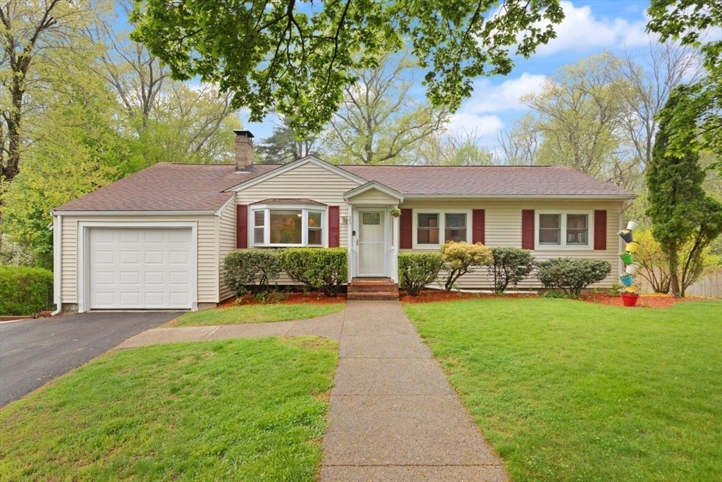 23 Gabriel Road Sharon, MA 02067 - Photo 40 of 41 a front view of a house with a yard and garage