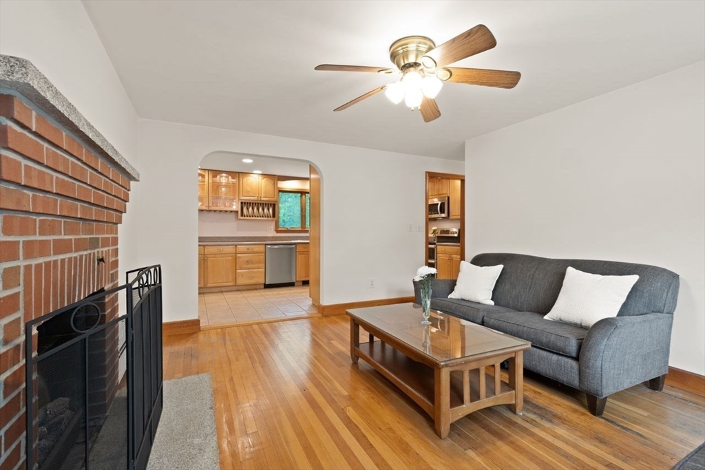 23 Gabriel Road Sharon, MA 02067 - Photo 5 of 41 a living room with furniture and a chandelier