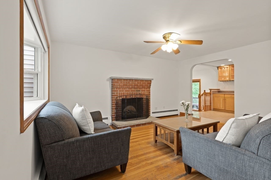 23 Gabriel Road Sharon, MA 02067 - Photo 7 of 41 a living room with furniture and a fireplace