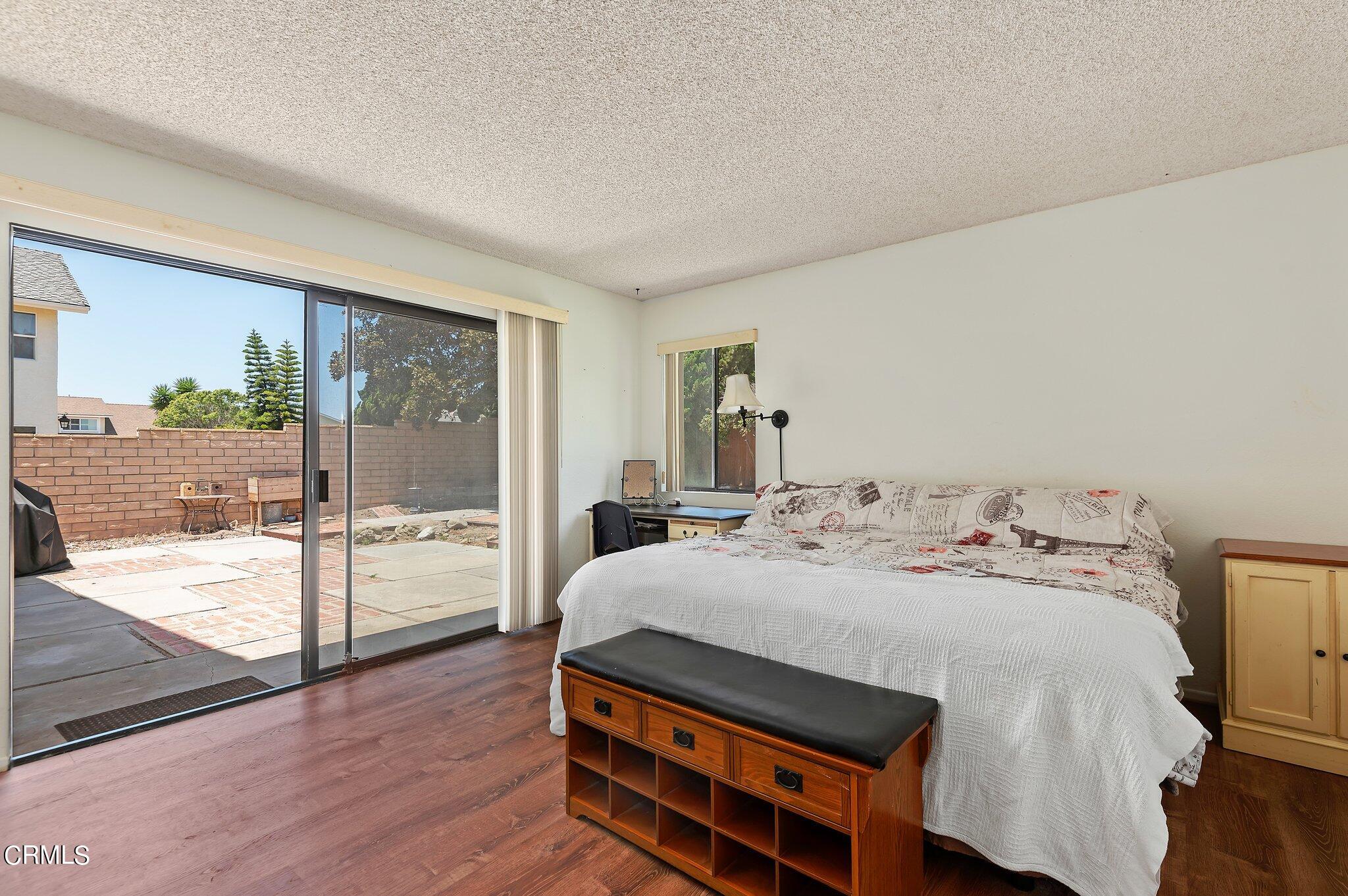 3041 Jacktar Avenue Oxnard, CA 93035 - Photo 11 of 19 a bedroom with a bed and wooden floor