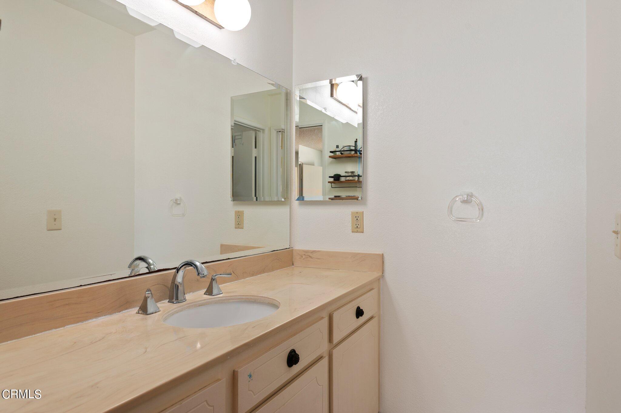 3041 Jacktar Avenue Oxnard, CA 93035 - Photo 12 of 19 a bathroom with a sink and a mirror