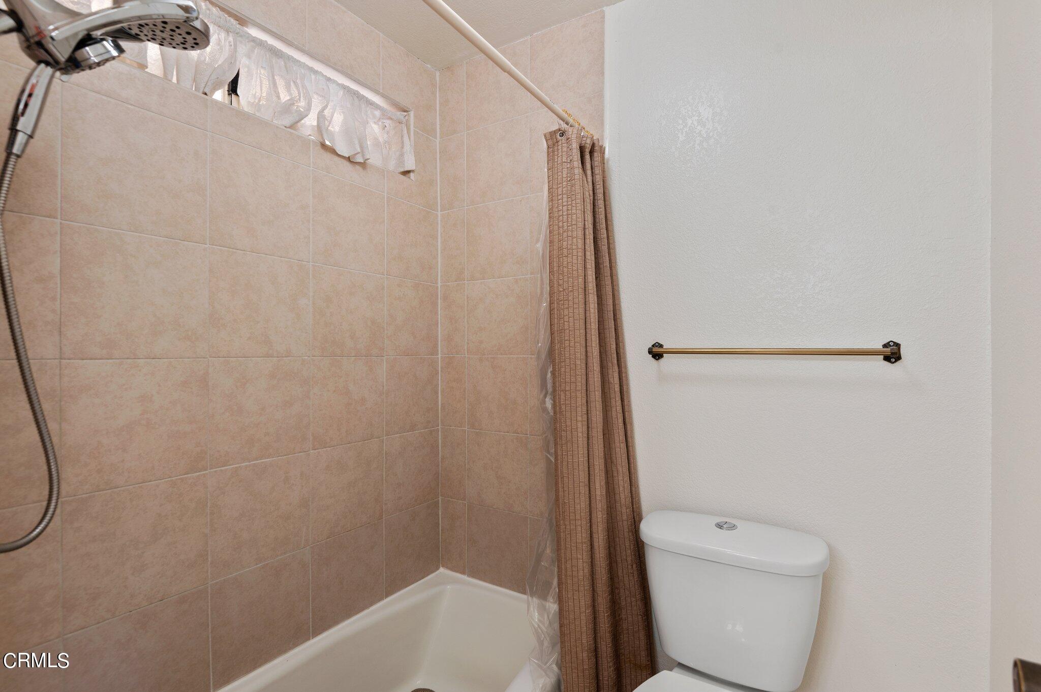 3041 Jacktar Avenue Oxnard, CA 93035 - Photo 13 of 19 a bathroom with a toilet and shower