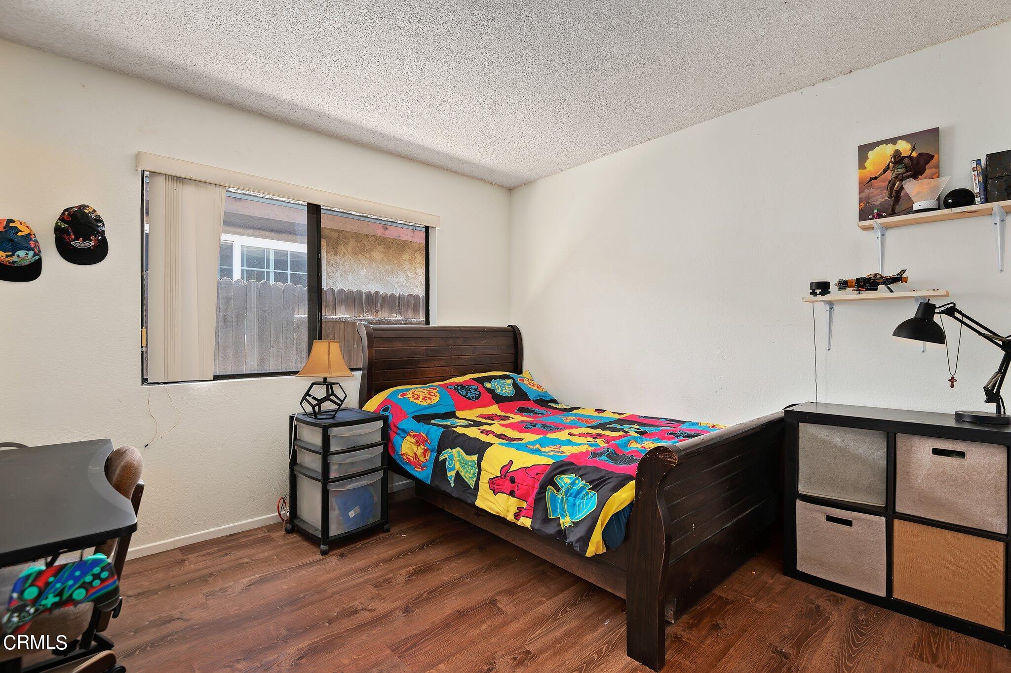 3041 Jacktar Avenue Oxnard, CA 93035 - Photo 14 of 19 a bedroom with a bed and a dresser in it