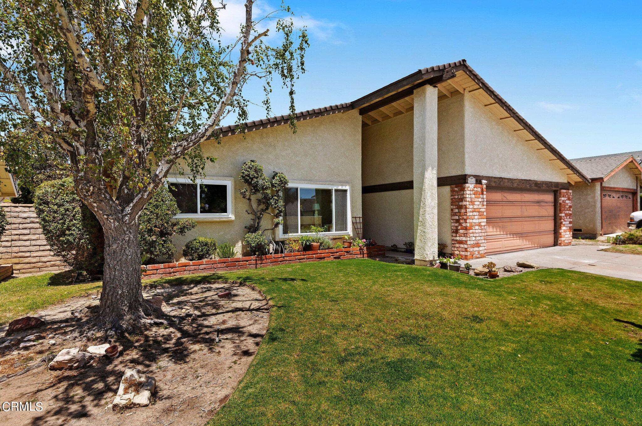 3041 Jacktar Avenue Oxnard, CA 93035 - Photo 2 of 19 a front view of a house with garden