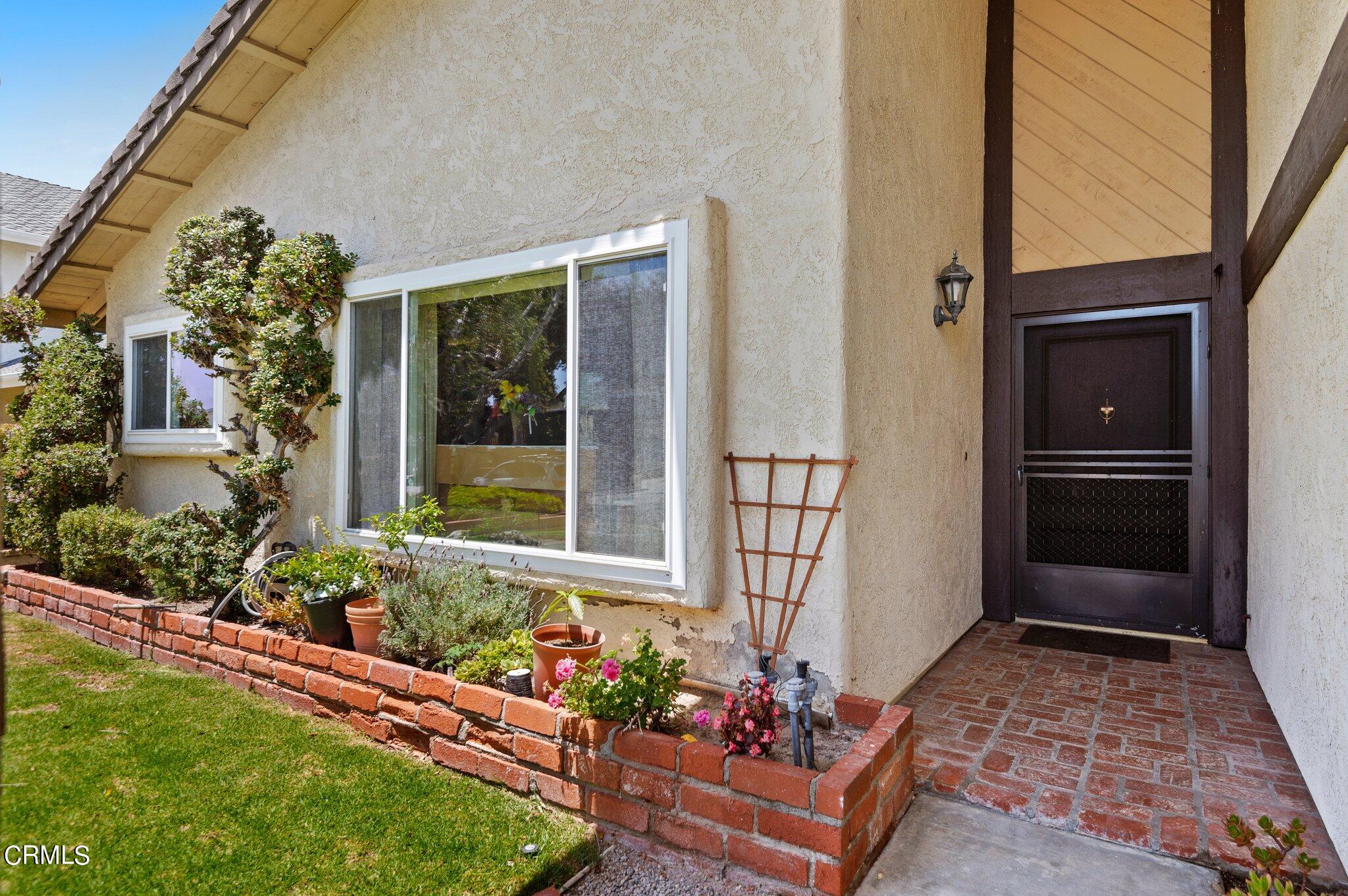 3041 Jacktar Avenue Oxnard, CA 93035 - Photo 3 of 19 a bunch of flowers in front of house