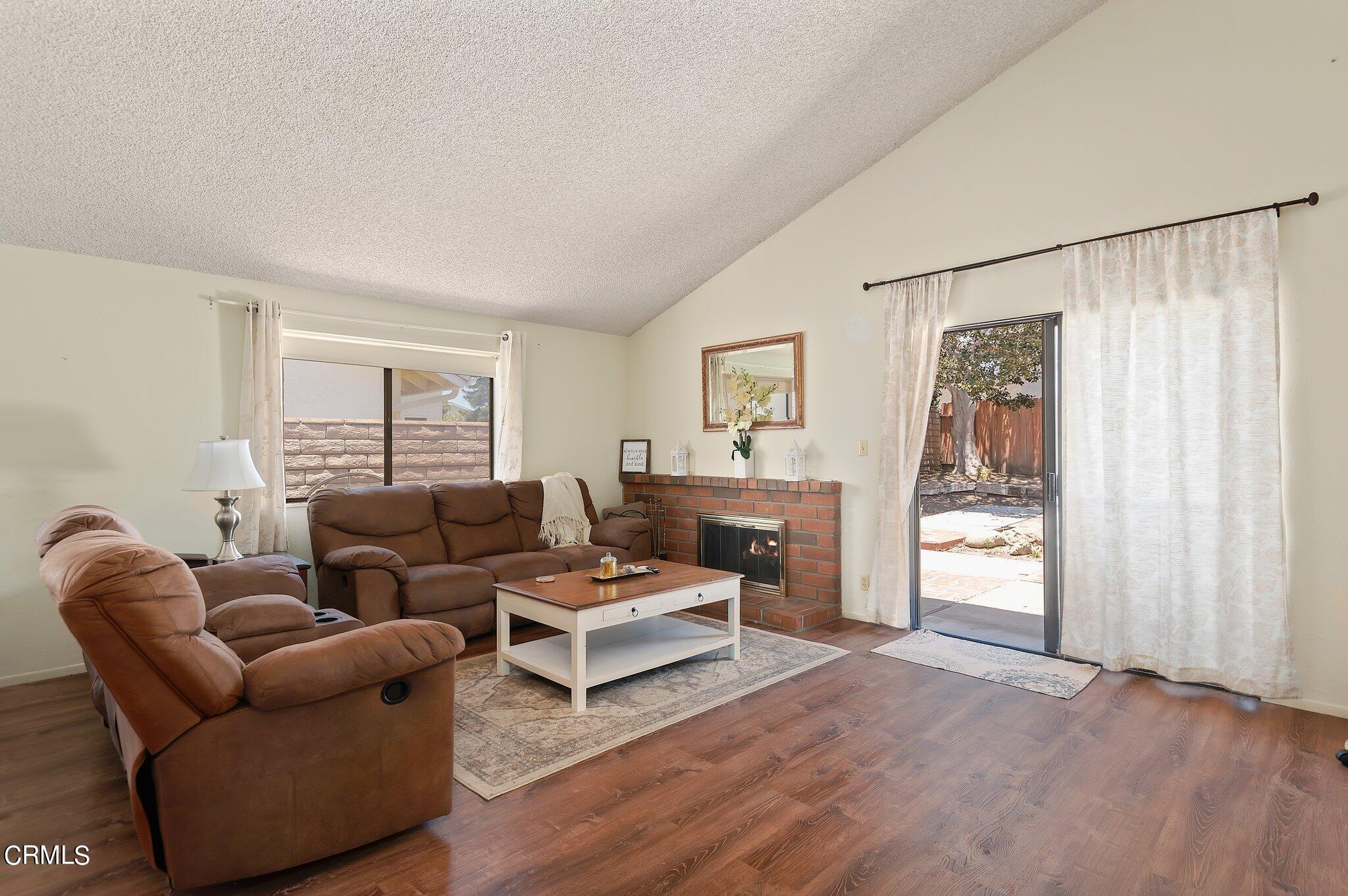 3041 Jacktar Avenue Oxnard, CA 93035 - Photo 4 of 19 a living room with furniture and a fireplace