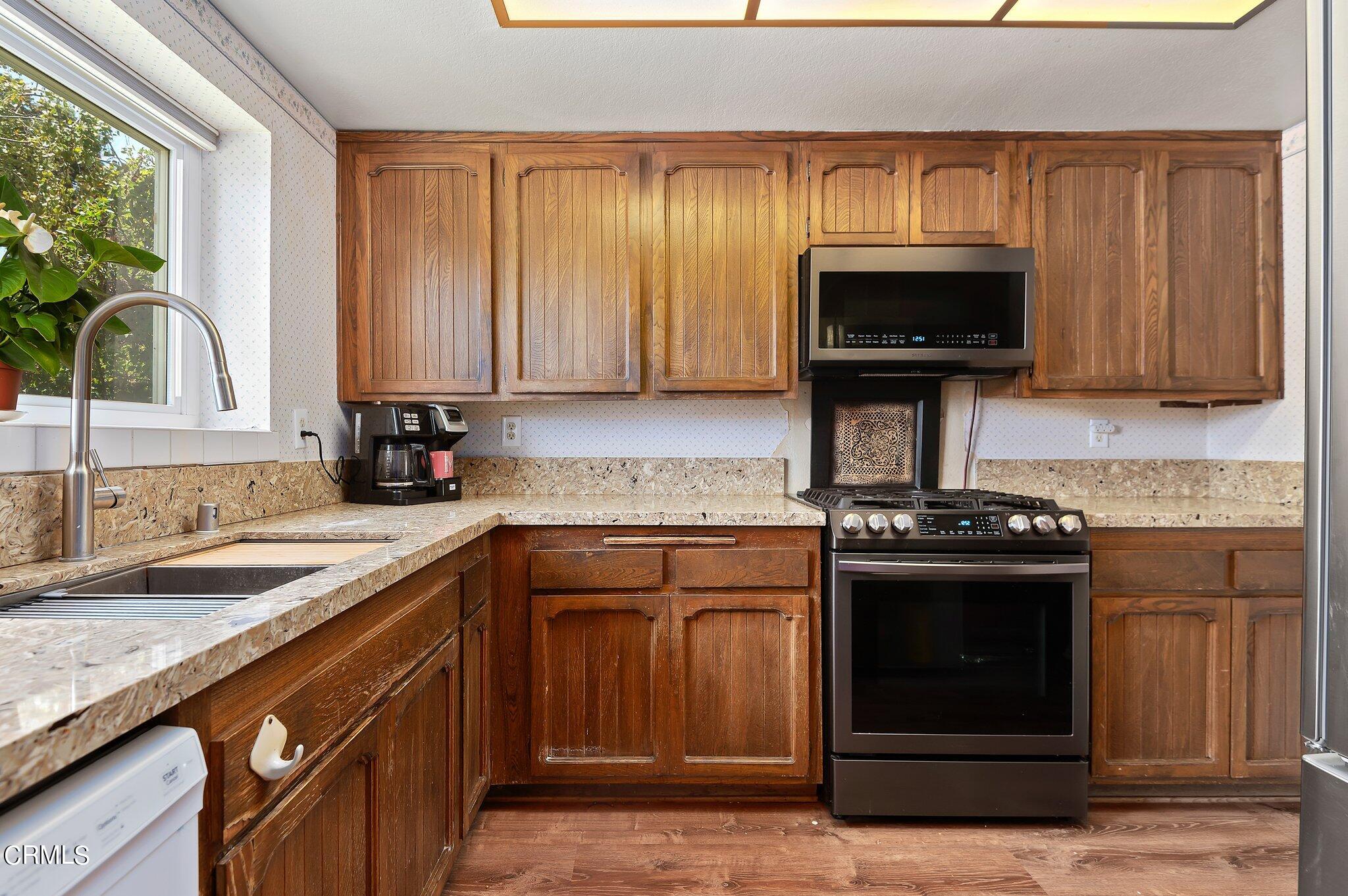3041 Jacktar Avenue Oxnard, CA 93035 - Photo 9 of 19 a kitchen with a stove and a sink
