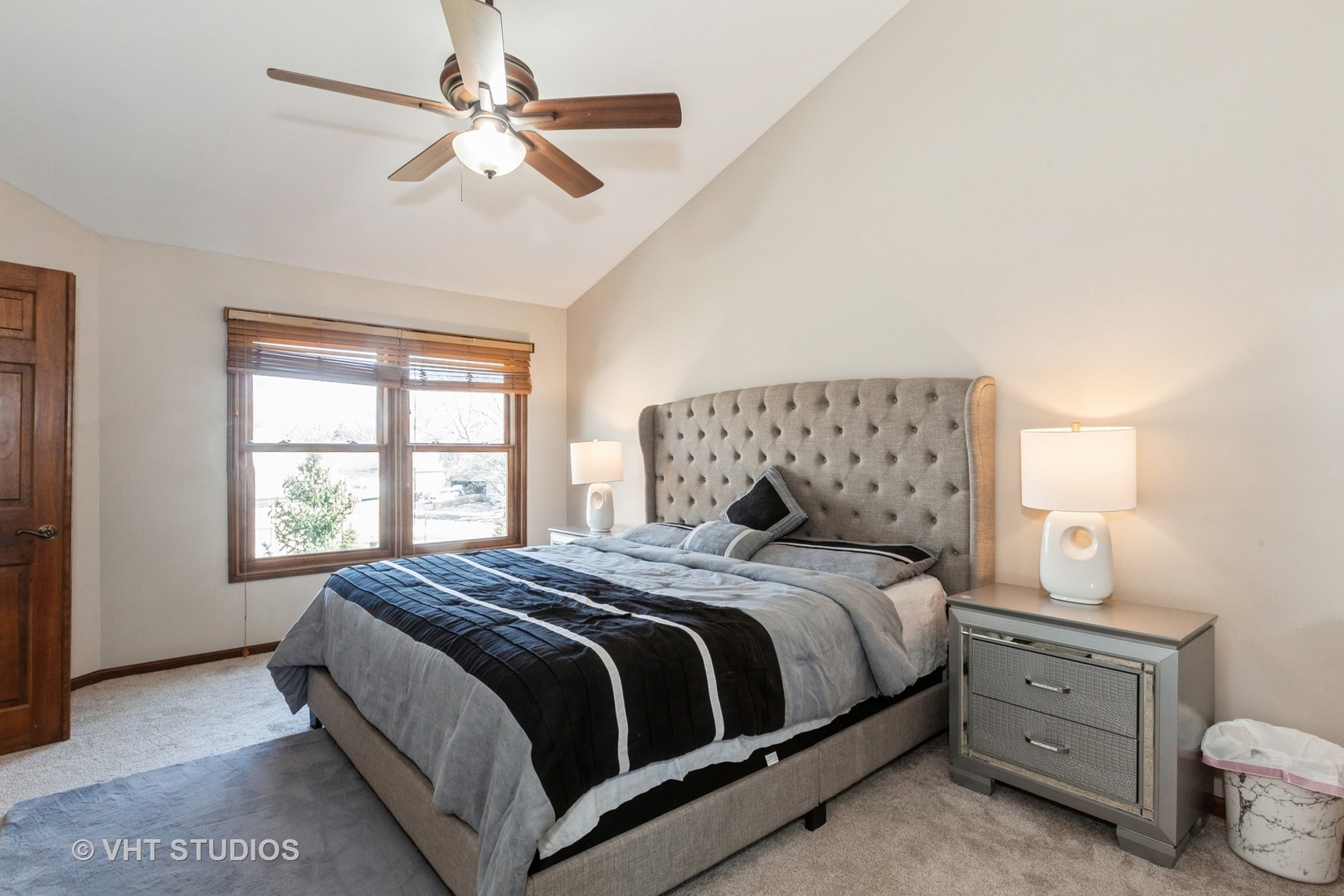 960 Heathrow Lane Naperville, IL 60540 - Photo 11 of 24 a bedroom with a large bed and a chandelier fan