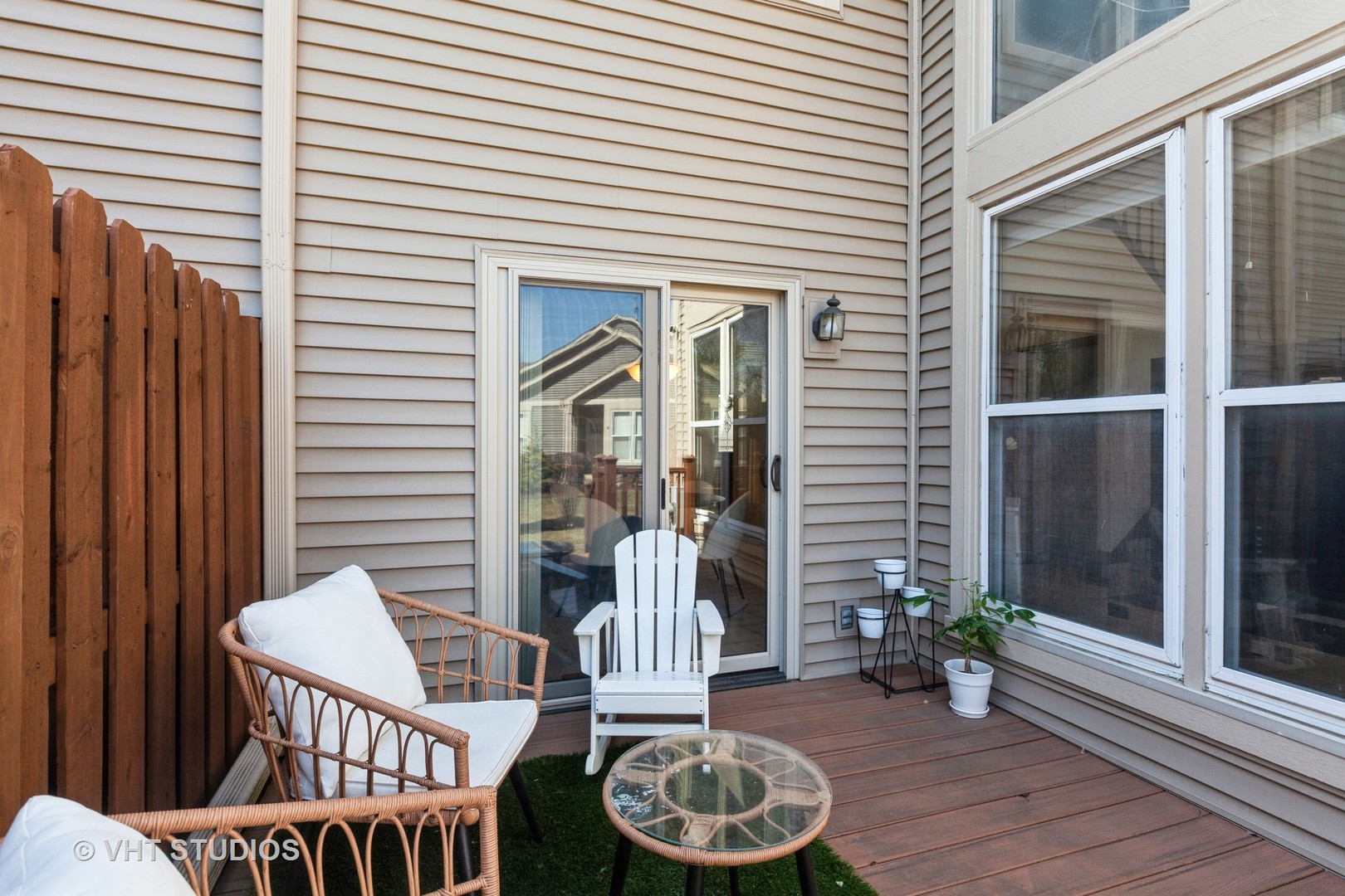 960 Heathrow Lane Naperville, IL 60540 - Photo 19 of 24 a view of a deck with a table and chairs and wooden floor