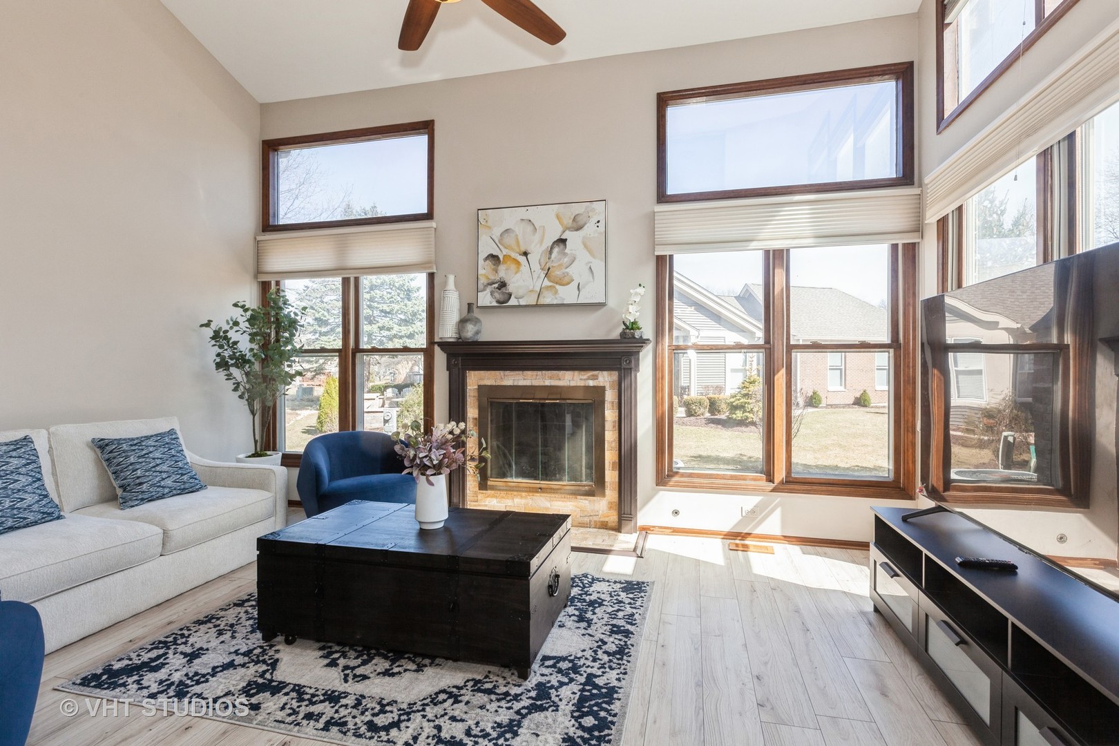 960 Heathrow Lane Naperville, IL 60540 - Photo 4 of 24 a living room with furniture large window and a fireplace