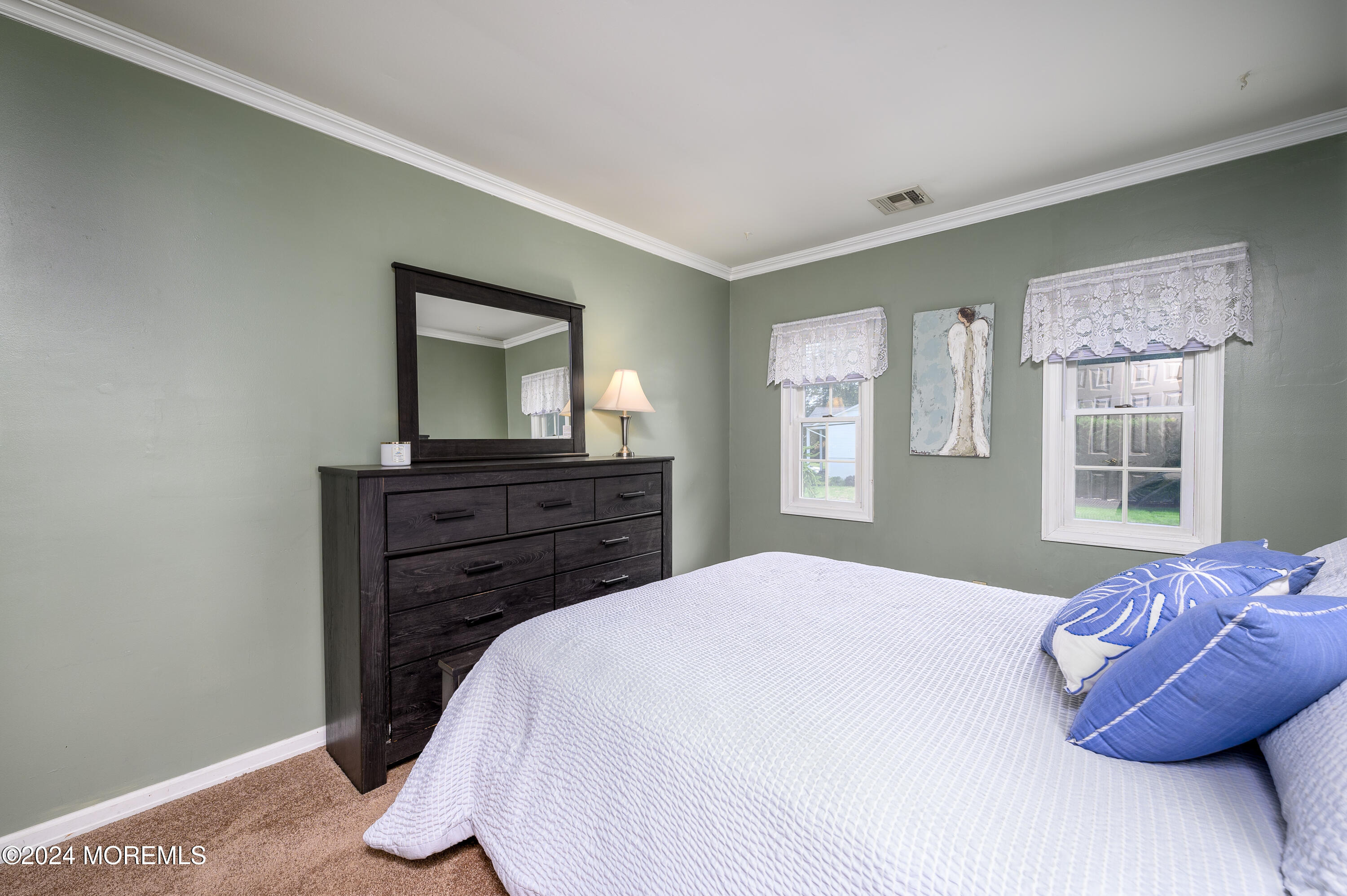 28 Chestnut Hill Road Howell, NJ 07731 - Photo 19 of 48 a bedroom with a bed and a dresser