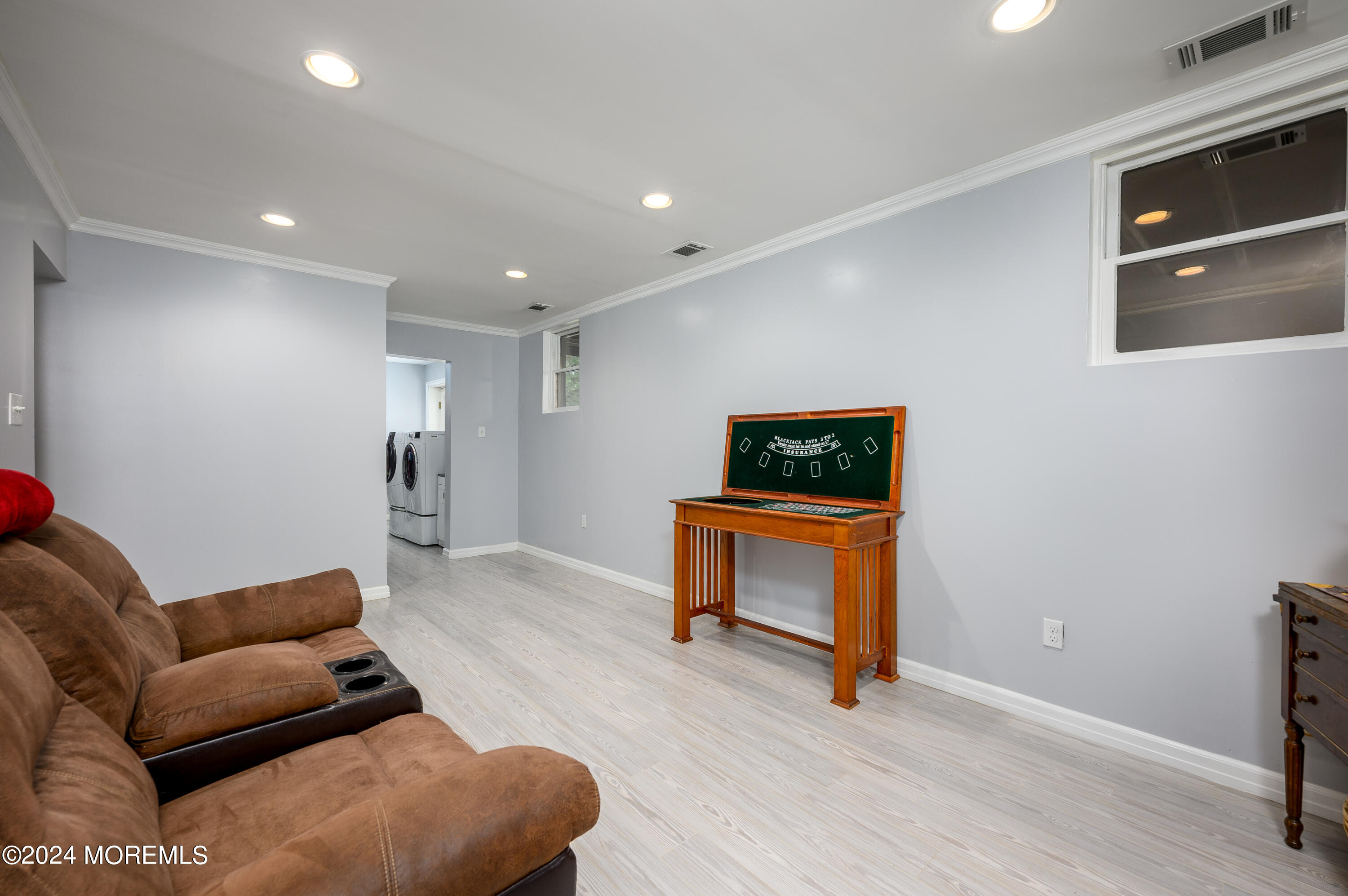 28 Chestnut Hill Road Howell, NJ 07731 - Photo 25 of 48 a living room with furniture and a wooden floor