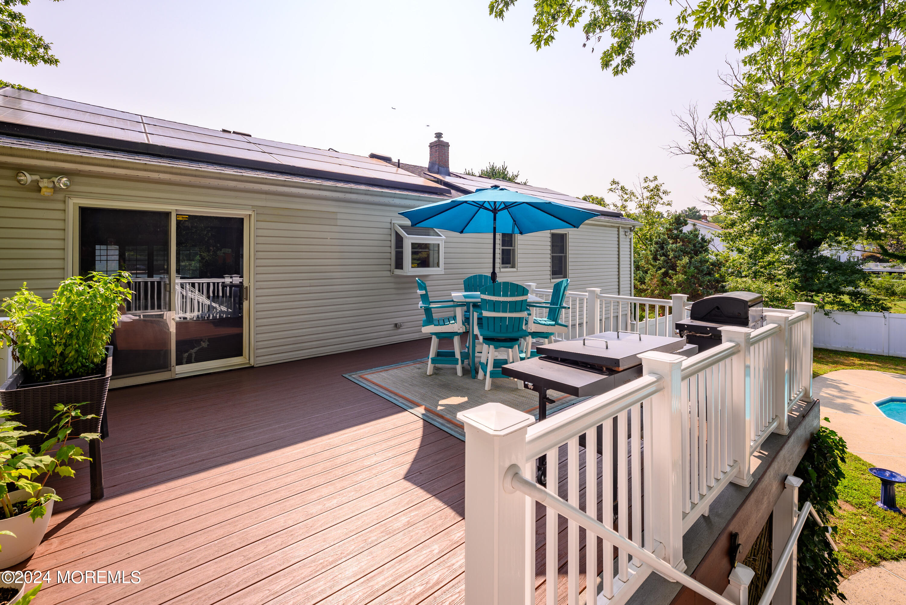 28 Chestnut Hill Road Howell, NJ 07731 - Photo 36 of 48 a roof deck with table and chairs and potted plants