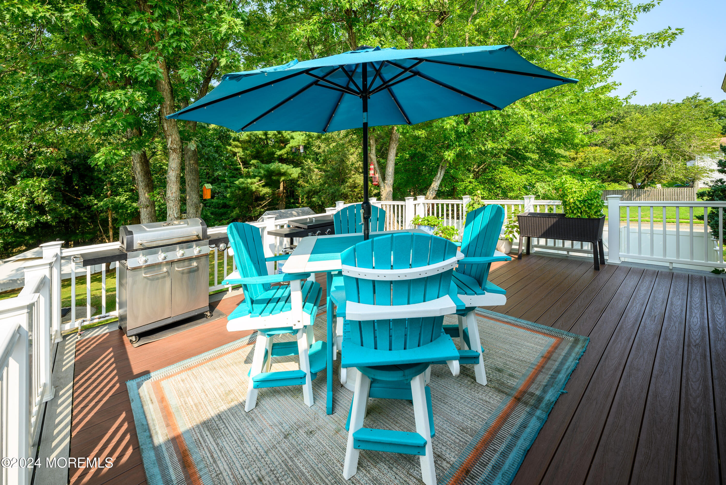 28 Chestnut Hill Road Howell, NJ 07731 - Photo 38 of 48 a view of balcony with outdoor seating and trees
