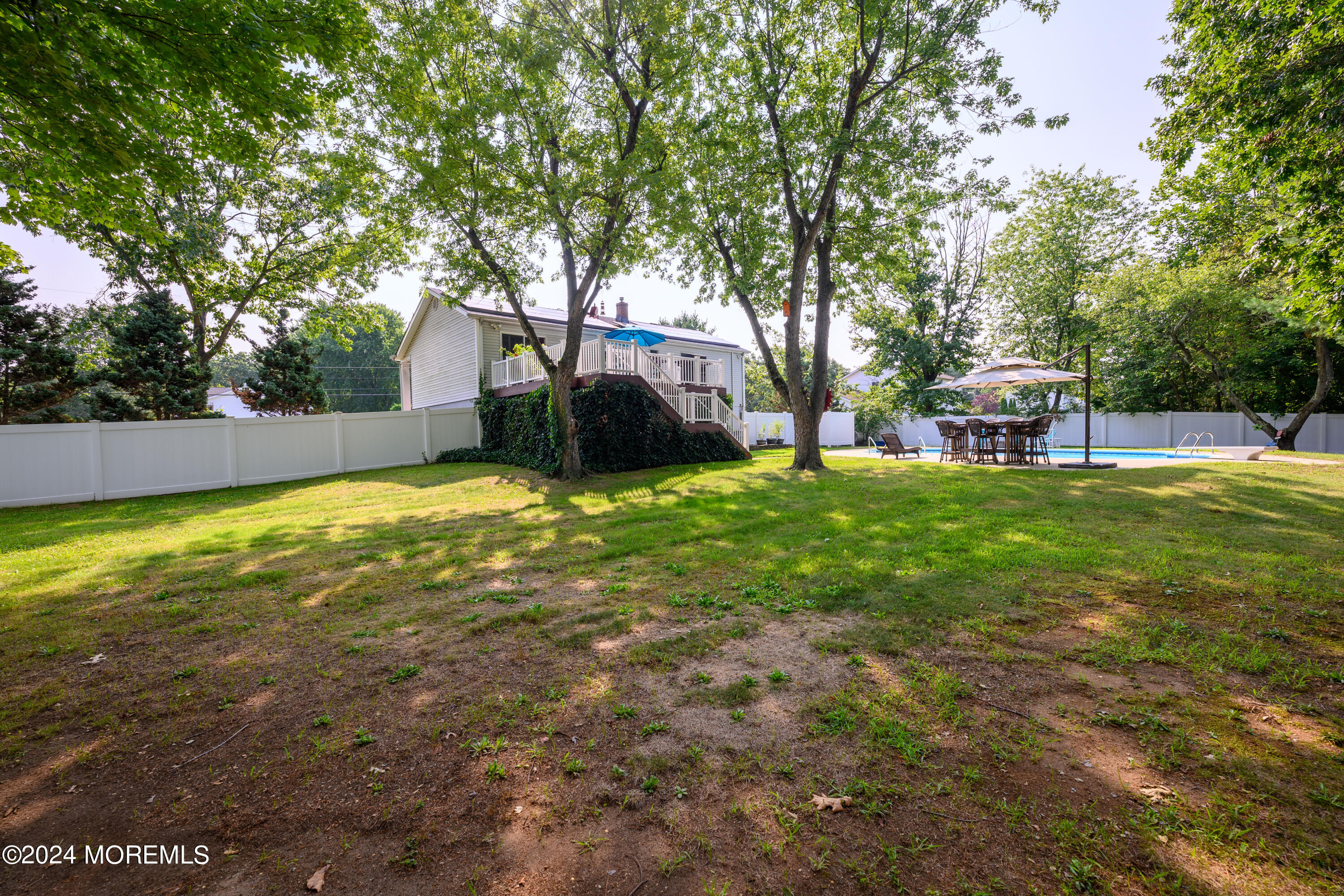 28 Chestnut Hill Road Howell, NJ 07731 - Photo 41 of 48 a view of a house with a yard and sitting area
