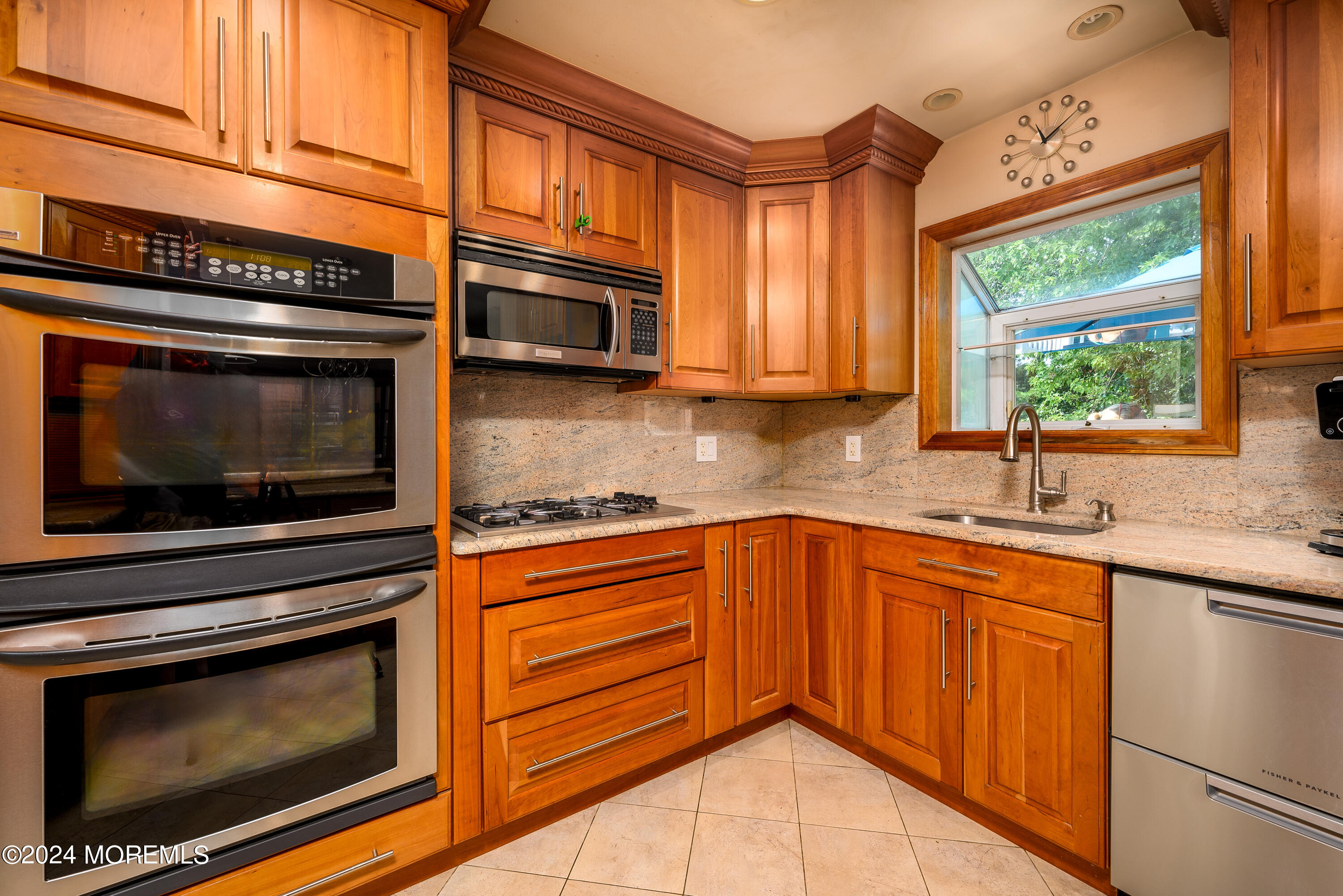 28 Chestnut Hill Road Howell, NJ 07731 - Photo 5 of 48 a kitchen with stainless steel appliances granite countertop a stove microwave and sink