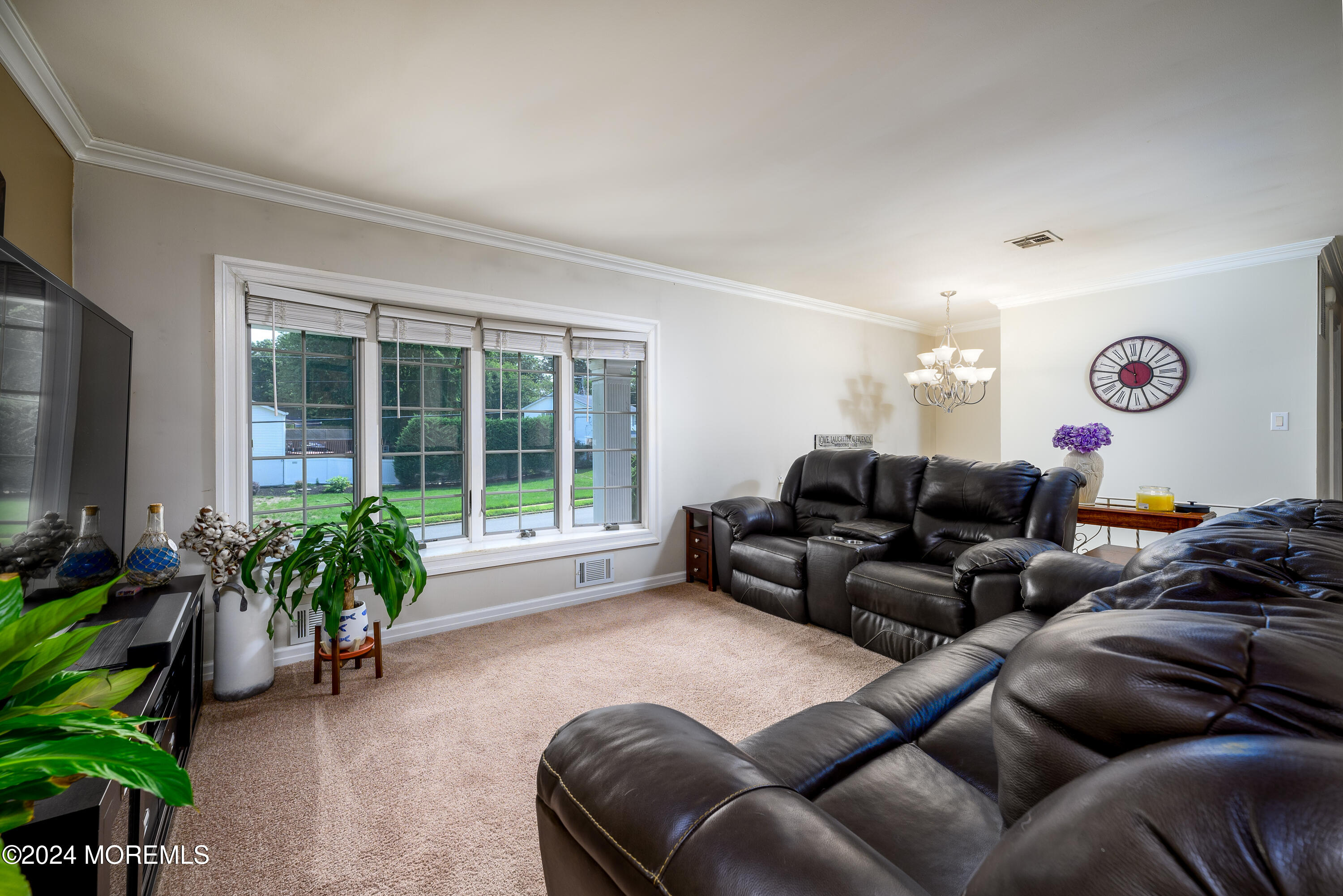 28 Chestnut Hill Road Howell, NJ 07731 - Photo 9 of 48 a living room with furniture plant and a window